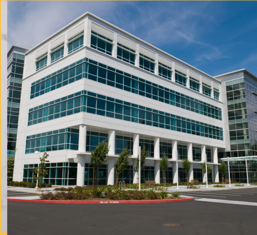 Modern office building exterior with glass windows.